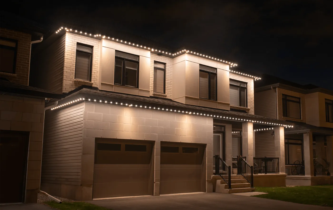 White architectural lighting on a two-story home