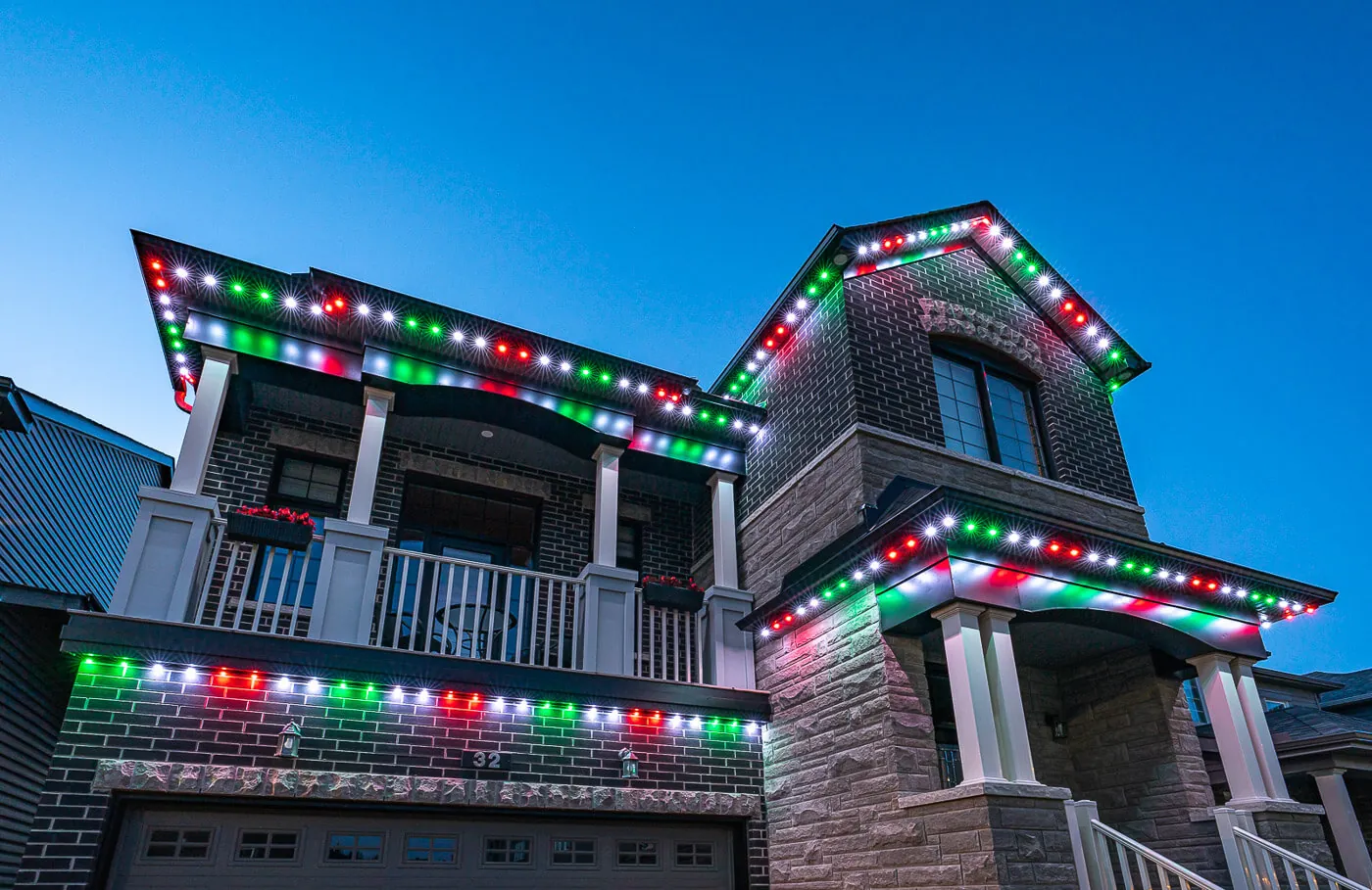 Celebright red, green and white Christmas lighting on a residential roofline