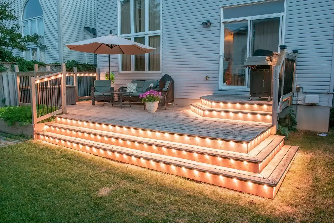 Warm lighting along a deck and steps